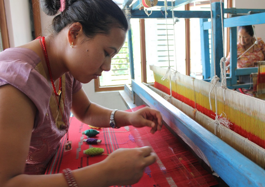 Woman learning weaving as a job skill